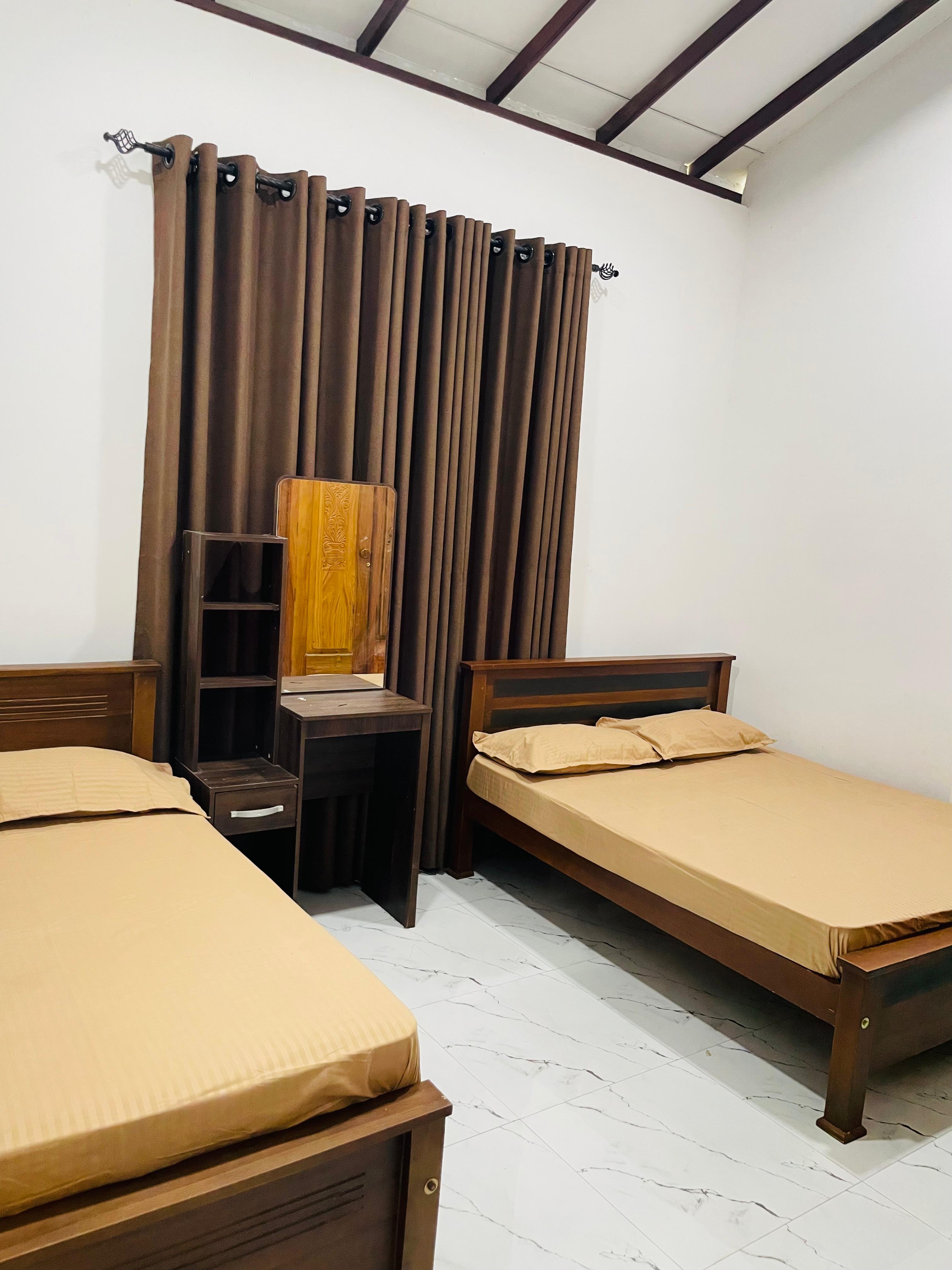 Two Family Rooms with Shared Bathroom(1 - A/C & 1 - Non A/C)